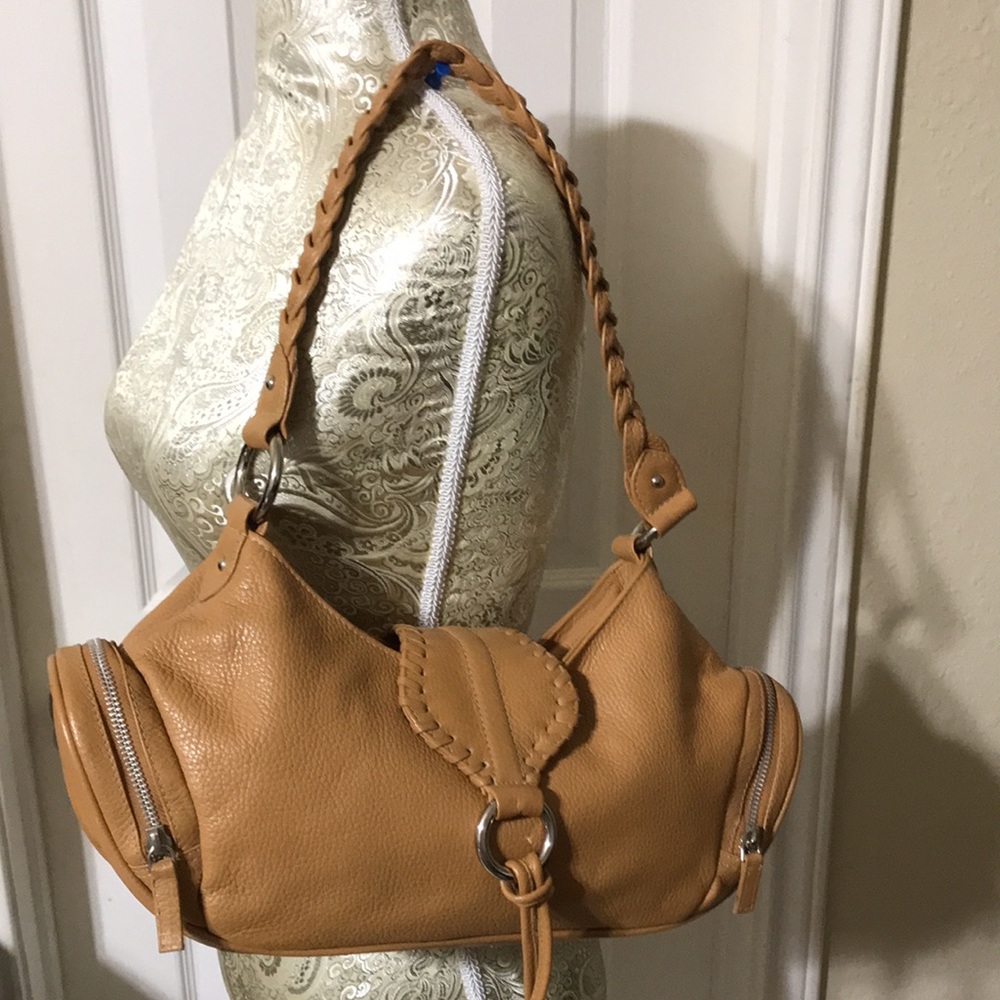Michael Rome leather shoulder bag with zip side pockets. EUC